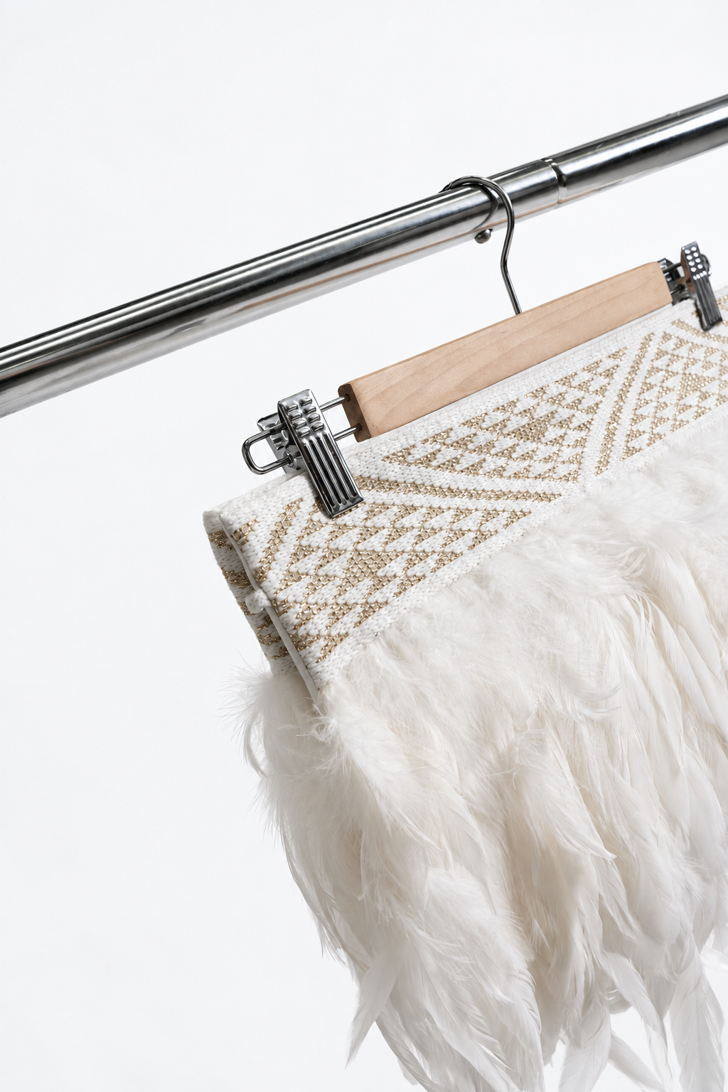 Hiwa White korowai — Gold tāniko hanger detail.