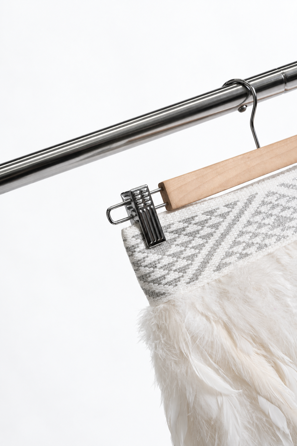 Hiwa White korowai — Silver tāniko hanger detail.