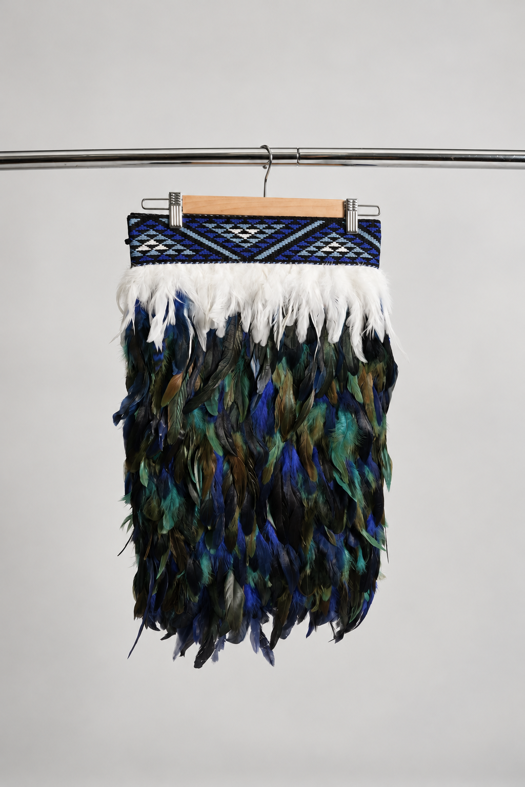 Moana Blue contemporary adult korowai in Half length, hanging front view.