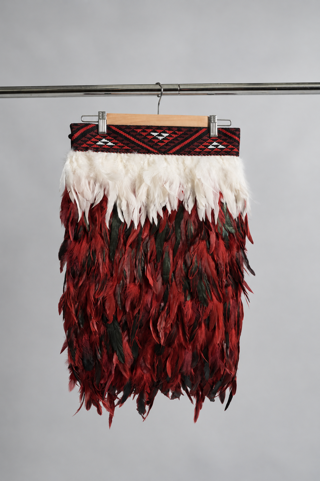 Rangatira Red adult Half length korowai, hanging front view