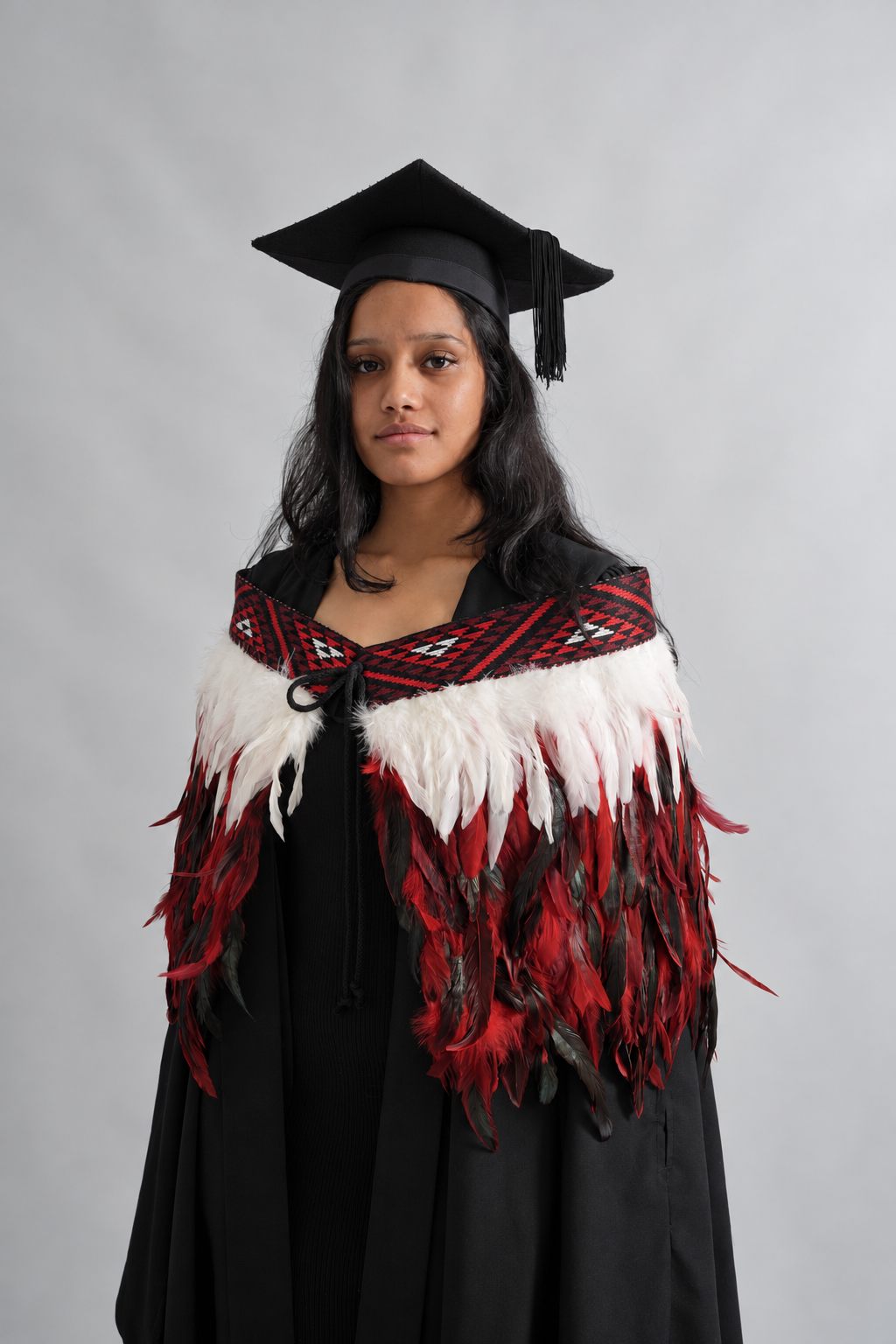 Graduation model wearing Rangatira Red korowai, front view