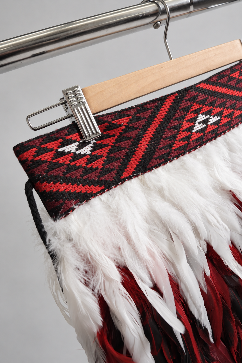 Angled detail of the Rangatira Red, black and white tāniko band