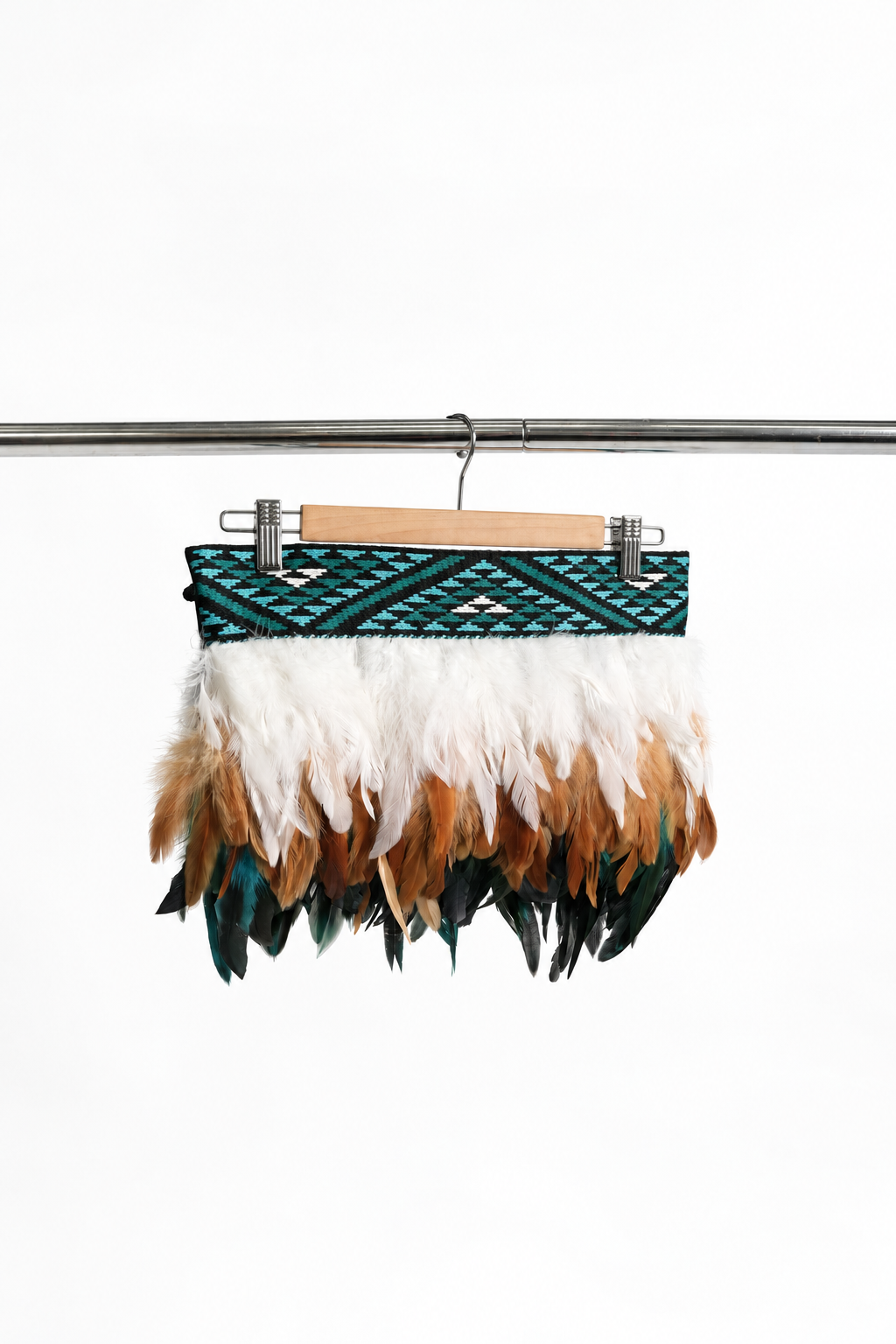 Kingfisher Blue adult Cape-length korowai on a hanger against a white backdrop.