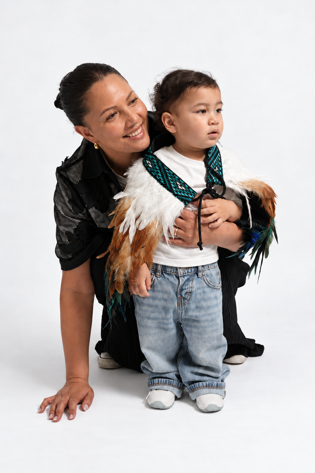 Mother and toddler wearing Kingfisher Blue children's korowai